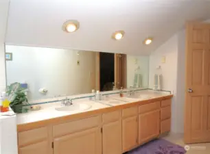 THE BATH CONTINUES WITH CANNED LIGHTING AND HUGE VANITY WITH DOUBLE SINKS!