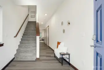 Stairs to upper level and entry to living area