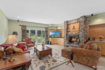 Very spacious L-shaped bonus room with its impressive ledger-stone gas fireplace, custom cabinets, wet bar & view deck! Perfect for entertaining or your own private retreat.