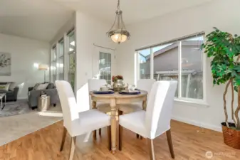 Separate dining room surrounded by windows for natural light.