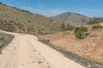 Road leading to the property on the right.