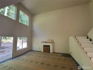 Great room with 18' tall ceilings and double stacked windows