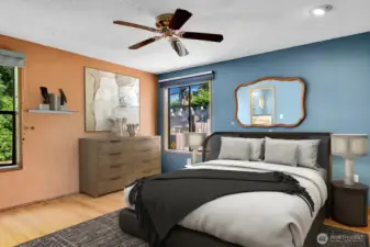 Primary bedroom with ample closet space and bamboo floors.