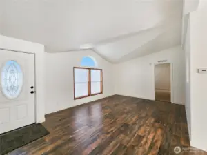 Light-filled main living area with new flooring and a welcoming layout—perfect for relaxing or entertaining guests.