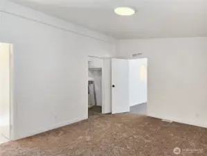 Generous walk-in closet with room to keep everything neatly organized—plenty of space for clothing, shoes, and personal treasures.