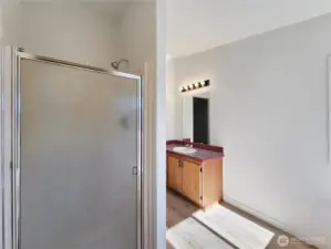 Spacious primary bath featuring dual sinks, separate shower, and a luxurious jetted soaking tub—your own private retreat.
