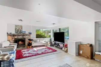 Downstairs recently updated family room with beautiful stone fireplace