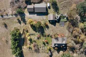 Birdseye view of the compound. You can see the garden pond to the west of the privacy berm and the fully fenced garden.