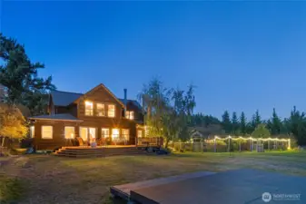 The farm house and garden at twilight.