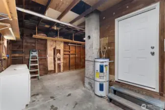 Garage, the door on the right goes to the kitchen, door to the left goes to the back yard. Shelving or shop area