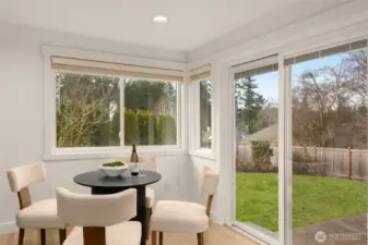 Eating area off kitchen has access to backyard