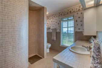 One of three Main House bathrooms w/meticulously tiled, snail-shell shower.