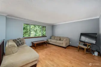 Easy maintenance laminate flooring here in the upstairs living room, so spacious and clean.