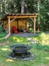 Owners added beautiful wood shelter w/wood burning stove on upper parcel