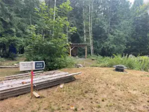 Sign marked at upper parcel; possible building spot for cabin