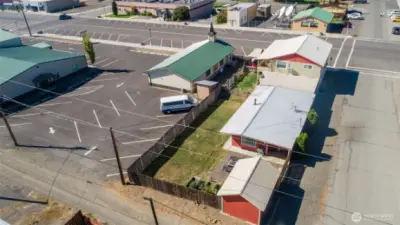 The 2bed/1bath home has a large fenced yard with garden space, covered patio, and entertaining areas, as well as a detached studio/bunkhouse.