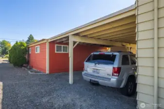 Tandem carport for additional tenant parking, located between the rear home and the front building.