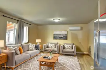 Virtually staged living room to show alternative style and function.