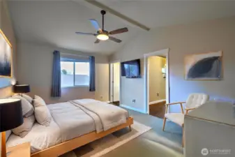 Large primary bedroom with vaulted ceilings and huge closet.