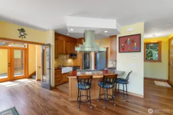 Six burner propane stove open to living and dining room, great for entertaining.