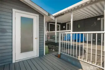 Coposite decking down to the outbuilding area as well.