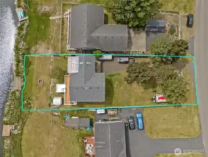 Large lot with mature trees and partially fenced.