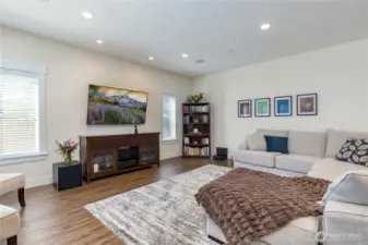 Living/great room with surround sound speaker system
