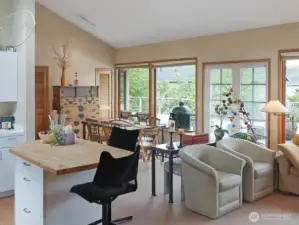 Once inside, you'll find vaulted ceilings, french doors that open wide to the back deck beyond, AIR CONDITIONING, and a kitchen with center island.