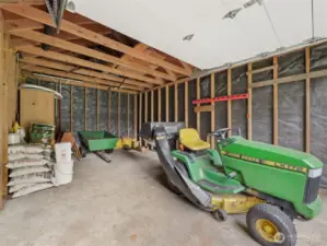The ride on mower and trailer comes with the house!
