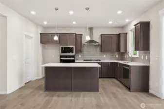 Gourmet Kitchen with free standing gas range.   Photos are for representational purposes only. Colors and finishes may vary