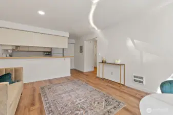 Tastefully updated with hard-surface floors throughout, freshly painted in a soothing neutral cream, and accented with stylish brushed-gold fixtures for an elegant, modern touch