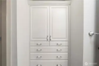 Guest bathroom with built-ins for extra storage.