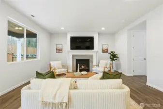 Great room on main level has cozy gas fireplace and large TV