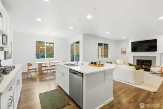 Kitchen and dining area open to fenced back yard and covered patio