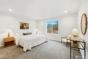 Primary bedroom offers plenty of space and features en-suite bathroom and large walk-in closet