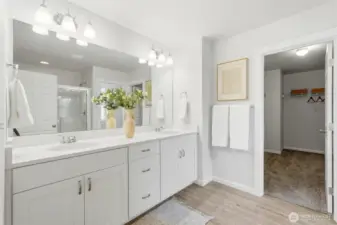 En-suite bathroom features double sinks, shower and large walk-in closet