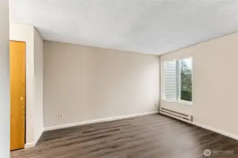 Primary bedroom with access to bath and private vanity.