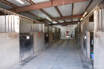 11 indoor stalls attached to covered arena