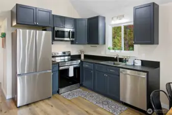 Efficient kitchen with quality appliances and finishes including Richlite countertops