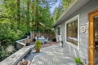 Deck off kitchen/family room has built-in bench seats and stairs to fully fenced patio.  All this surrounded by natures beauty.  You can relax and enjoy this space.