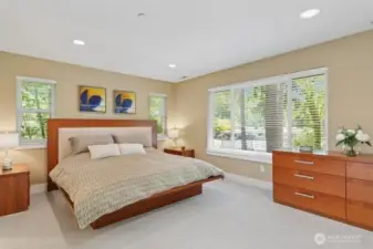 Upstairs boasts primary suite with 5-piece bath, large custom California organizer in the walk-in closet.