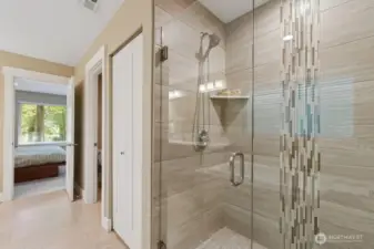 Luxurious primary suite with 5-piece bath located upstairs. Private room for toilet