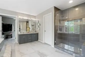 Oversized tiled shower with siting bench in the Master Bath create a richly romantic space