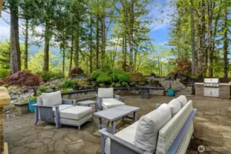 One of two sitting areas to entertain in with built-in Barbeque, Stone fireplace ( to the Left) and Pizza Oven ( Not shown)