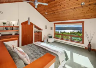 Primary suite with its own stair to family room. Lovely sound and mountain views from this room.
