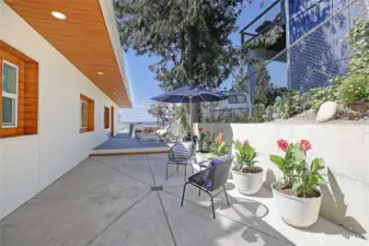 Hardscaped side of home fully usable for grilling, relaxing. Has water views!