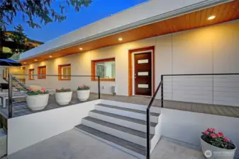 twilight view of home, lots of exterior lighting