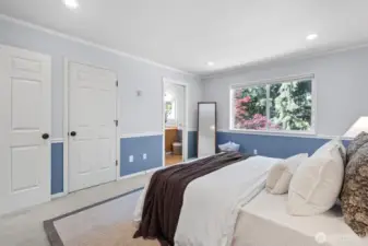Primary bedroom suite upstairs with full bath and walk in closet.