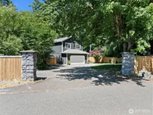 Property entrance via driveway off 55th Ave Ct NW.