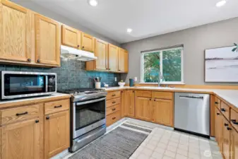 with gas stove and stainless appliances
